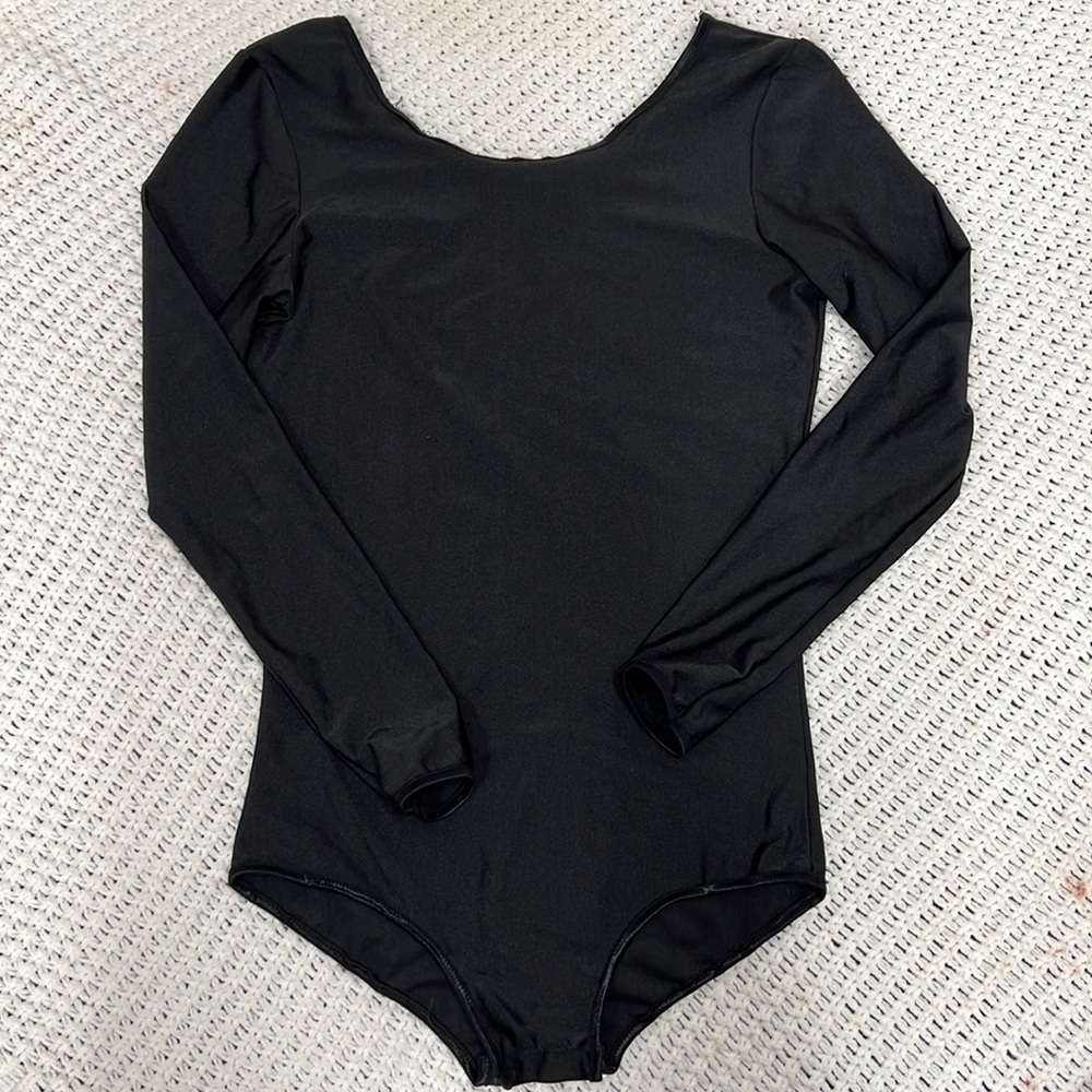 Spandex material long sleeve body suit that clips!
